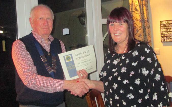 Lion President Ian Pearson Presenting a Certificate of Appreciation at the Rampant Cat
